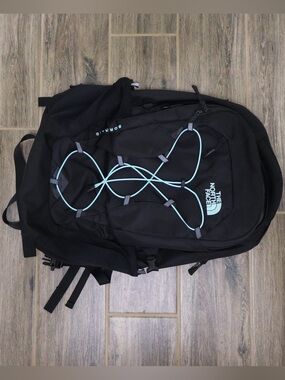 The North Face Black Backpack with Light Blue Bungee Cord